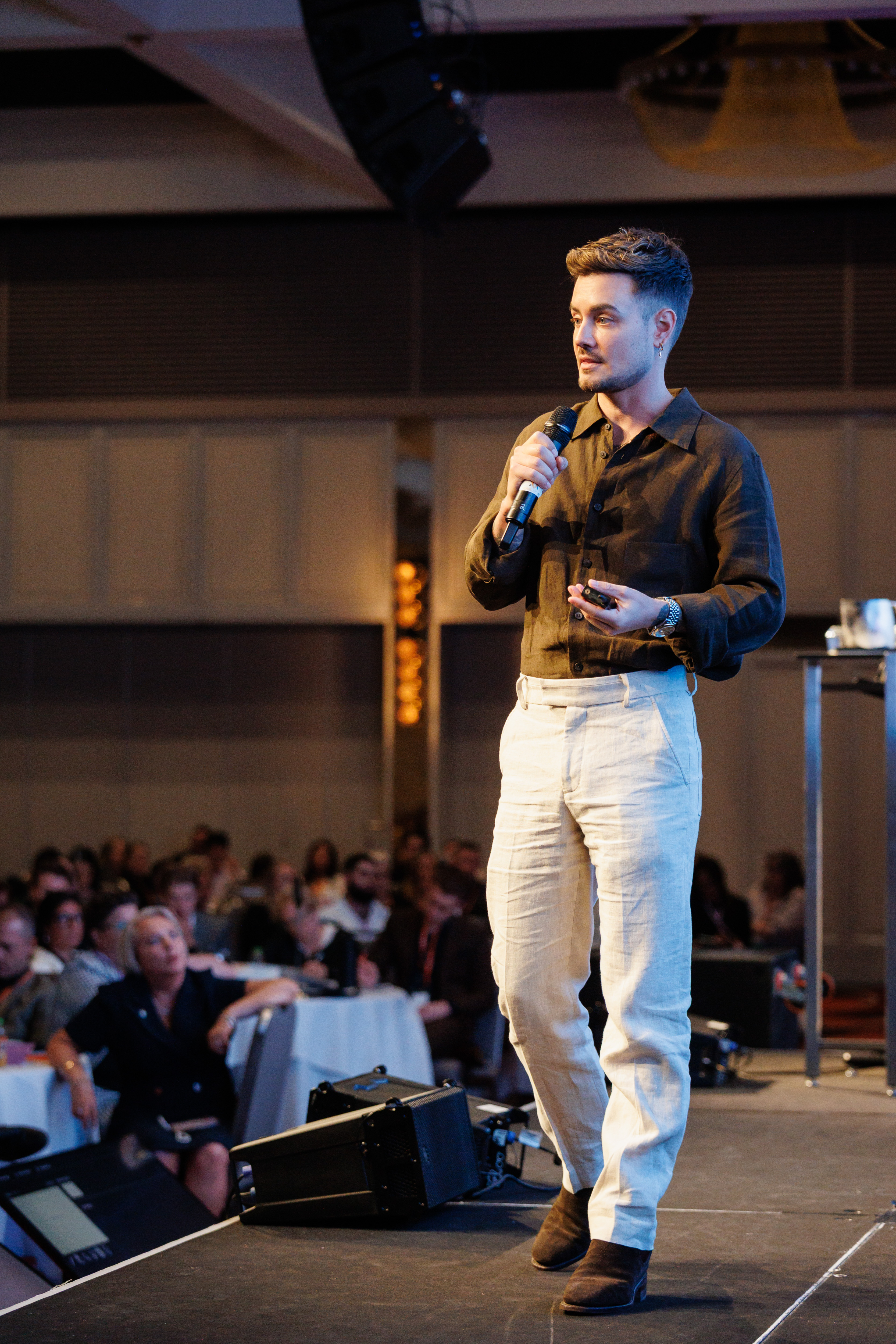 Mitch Wallis speaking on stage
